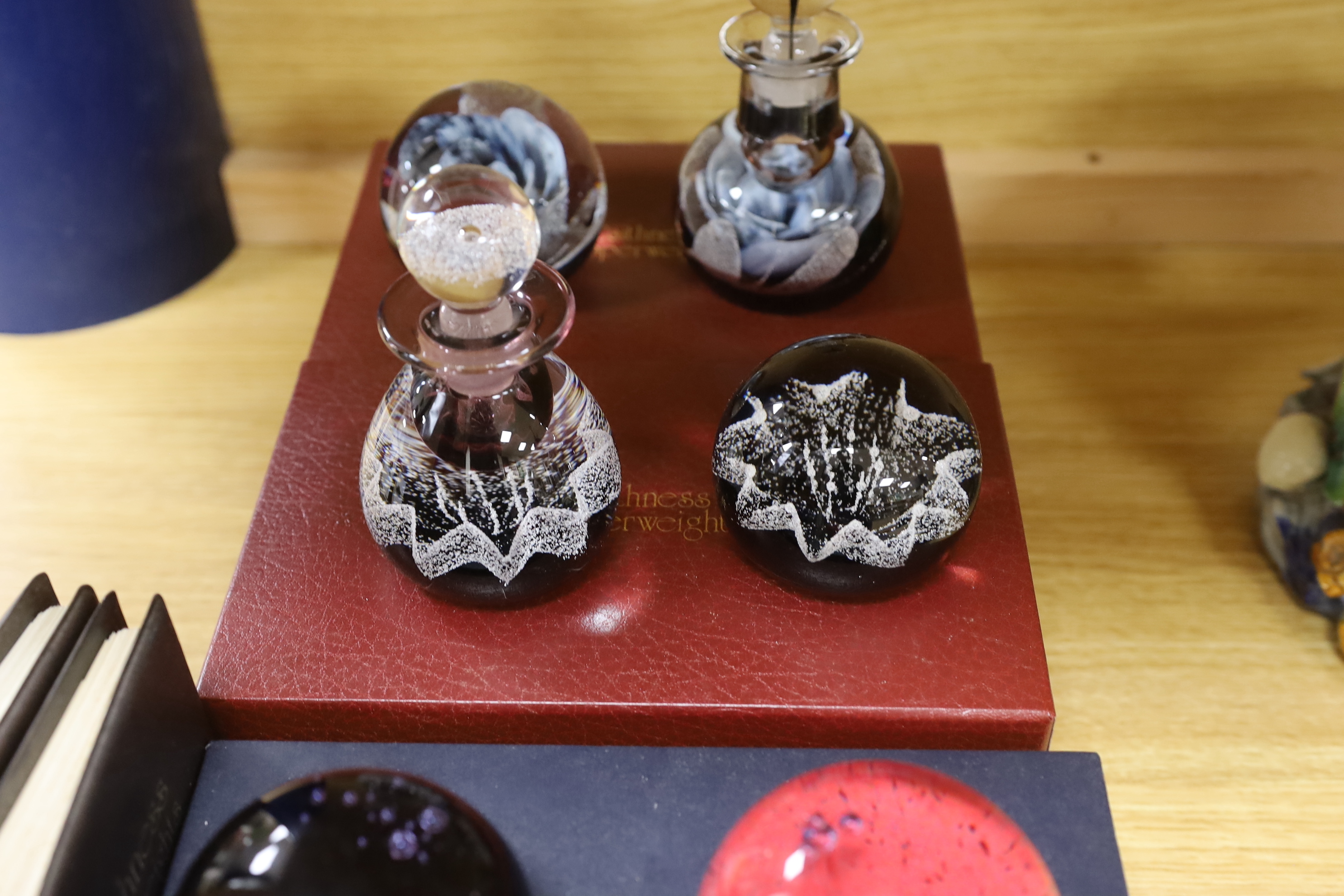 Caithness, three boxed sets comprising scent bottles and paperweights together with two Caithness Collector's Guides, each with boxes, limited editions, the largest 15cm high
